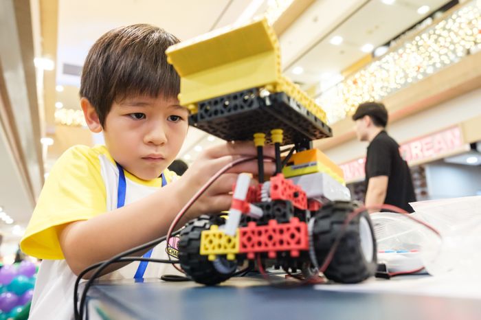 Participant building a competition robot