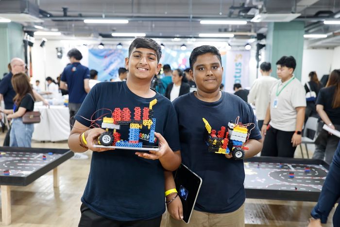 Teammates showing their robots